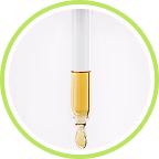 A drop of aminexil at the tip of a pipette